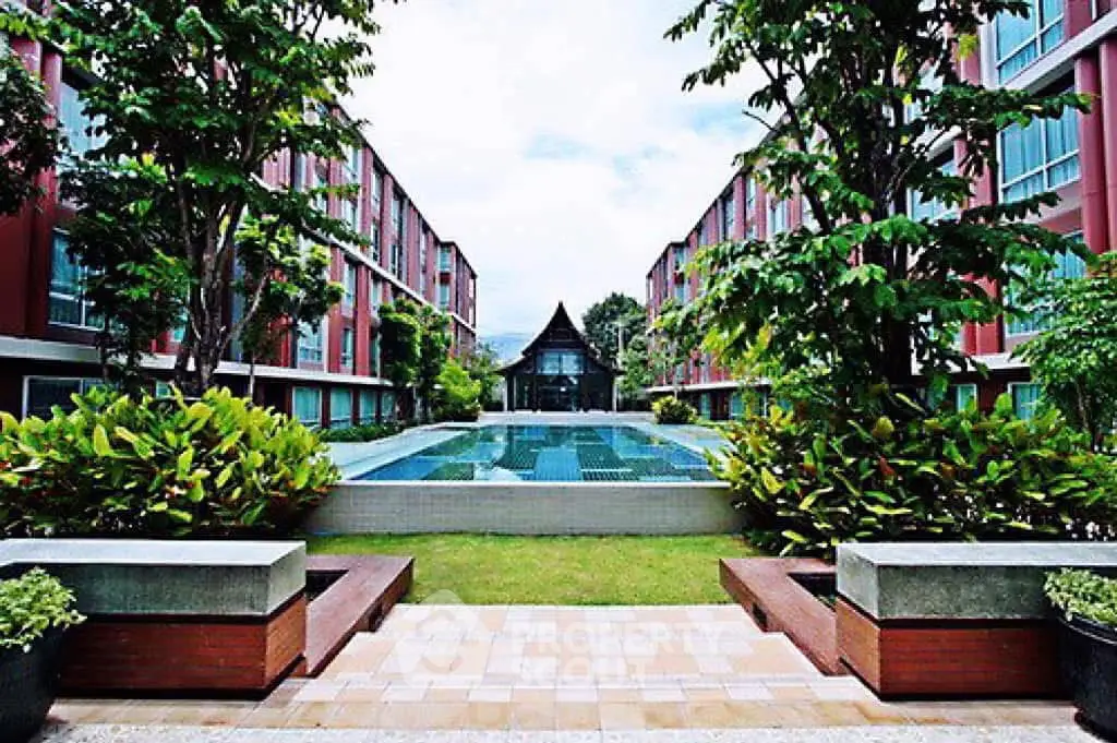 Stunning apartment complex with lush gardens and inviting pool area