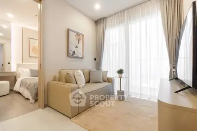 Modern living room with cozy sofa and large window in stylish apartment