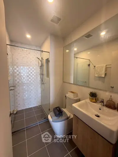 Modern bathroom with glass shower and sleek fixtures