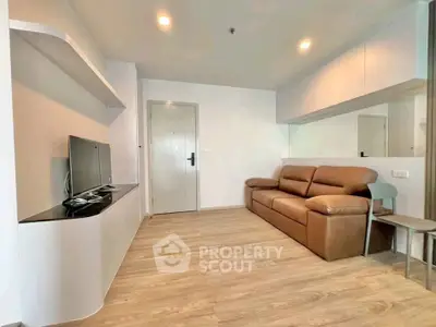 Modern living room with sleek design and comfortable brown sofa