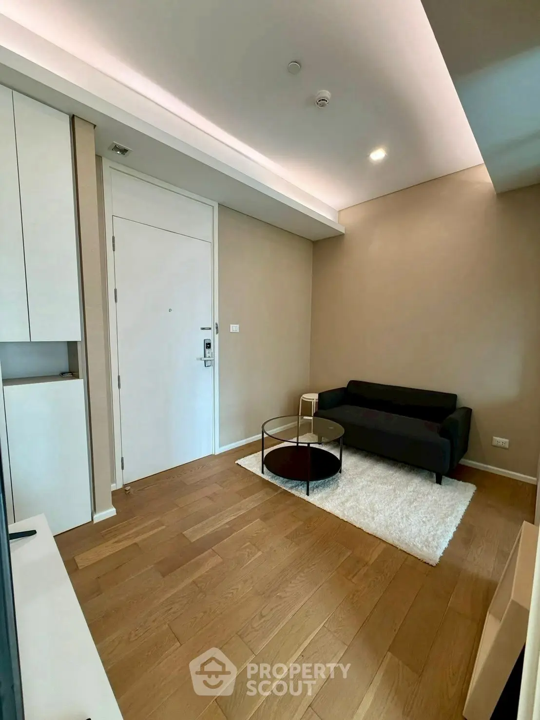 Modern living room with sleek furniture and wooden flooring