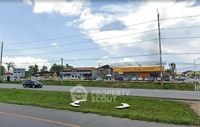 Commercial property with ample parking and roadside visibility
