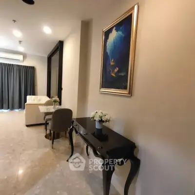 Elegant living room with stylish furniture and art, featuring a cozy ambiance and modern decor.