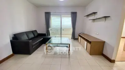 Modern living room with balcony view and sleek furniture