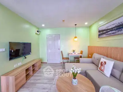 Charming living room with modern decor, cozy sofa, and wall-mounted TV in a stylish apartment.