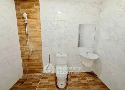 Modern bathroom with elegant tile design and sleek fixtures
