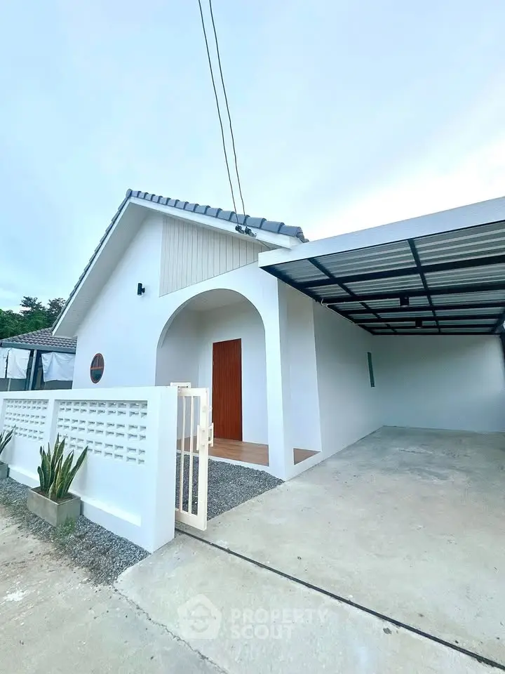 Modern minimalist white house with carport and stylish entrance