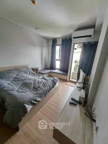 Modern bedroom with balcony access and stylish decor