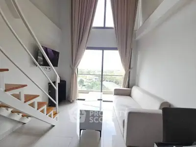 Modern living room with high ceiling and large window offering scenic view