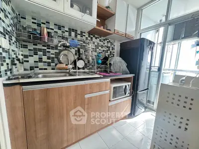 Modern kitchen with wooden cabinets and mosaic backsplash