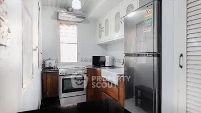 Charming kitchen with modern appliances and sleek design, perfect for culinary enthusiasts.