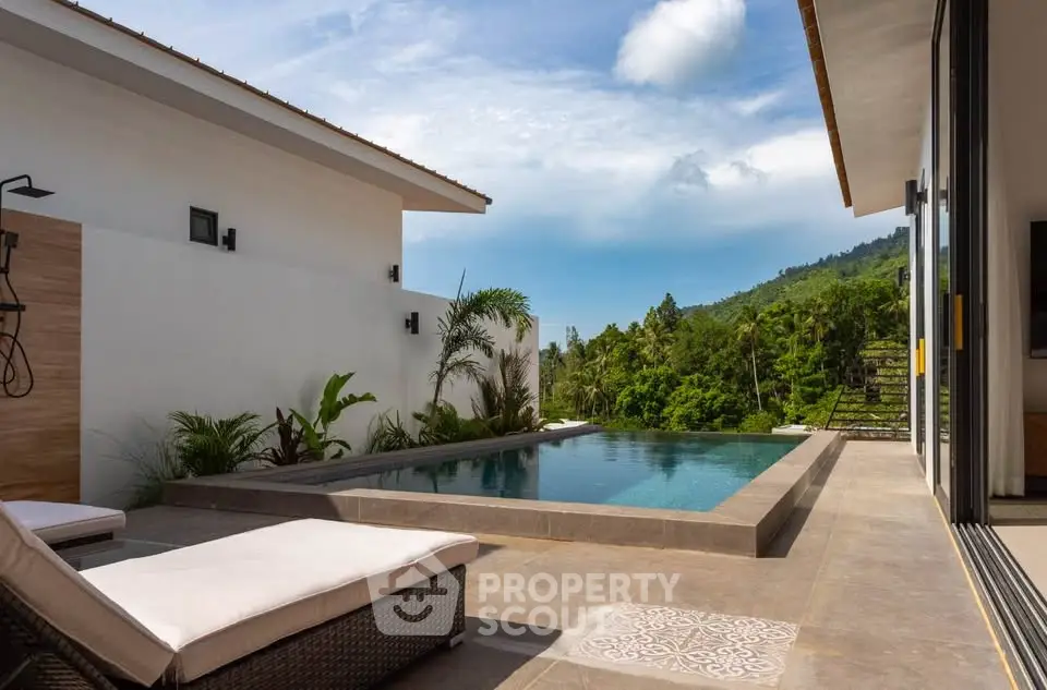 Luxurious villa with private pool and stunning mountain views, perfect for relaxation and tropical living.