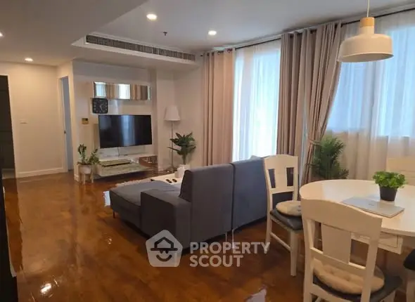 Spacious modern living room with wooden flooring and elegant decor