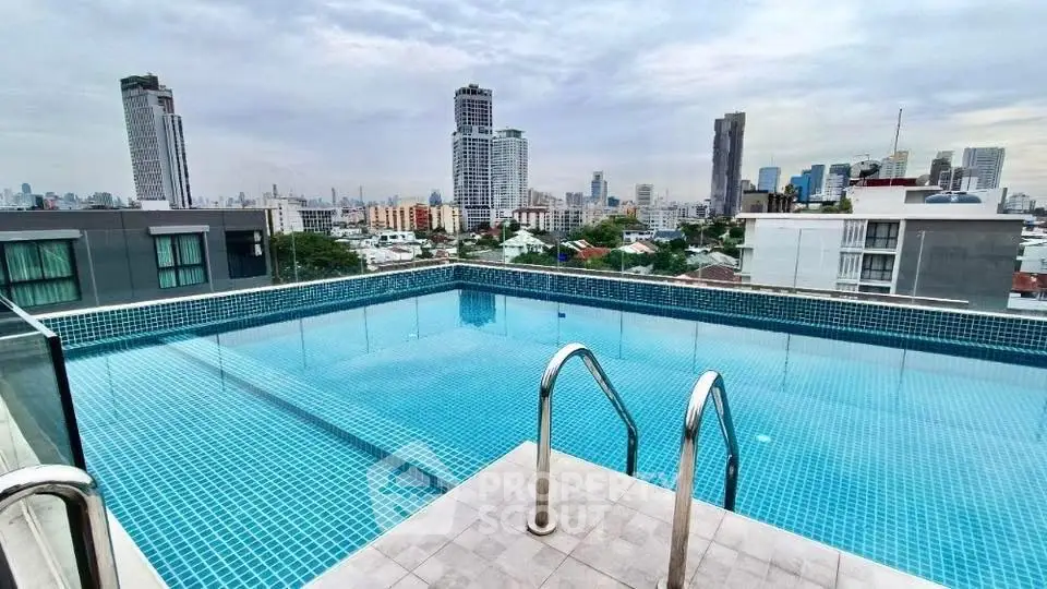 Stunning rooftop pool with panoramic city skyline views