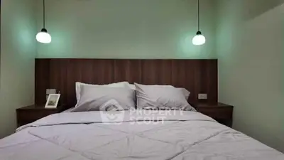 Cozy bedroom with modern lighting and wooden headboard