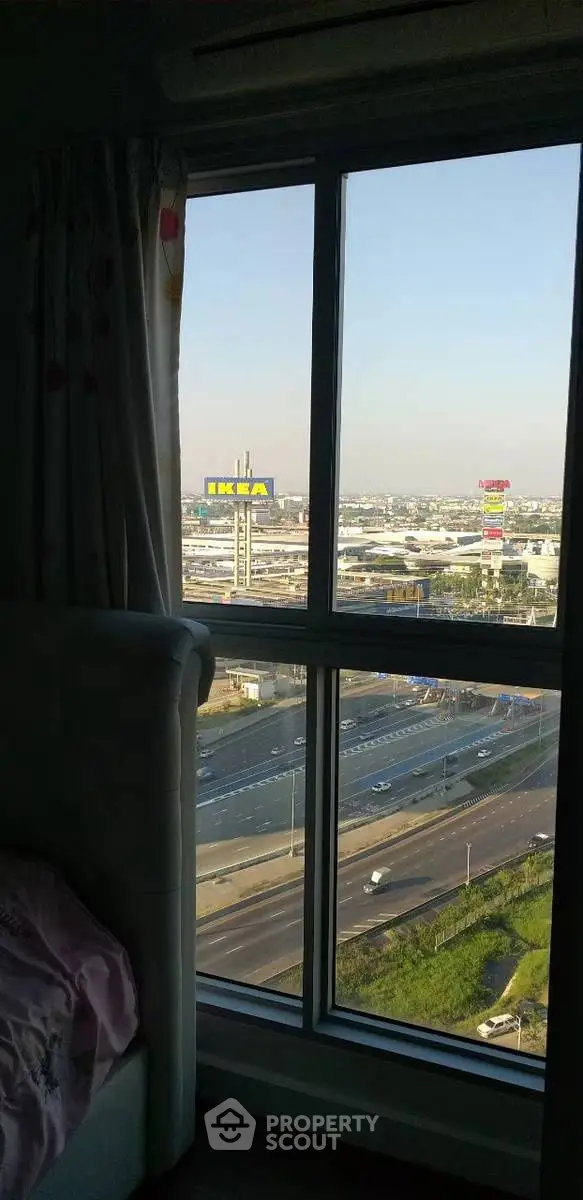 High-rise apartment with stunning city view overlooking highway and IKEA store.