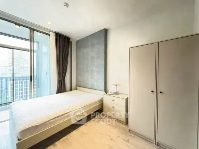 Modern bedroom with balcony view in urban apartment