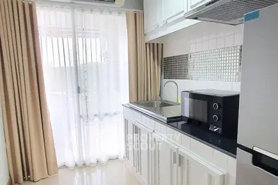 Modern kitchen with sleek cabinetry and natural light