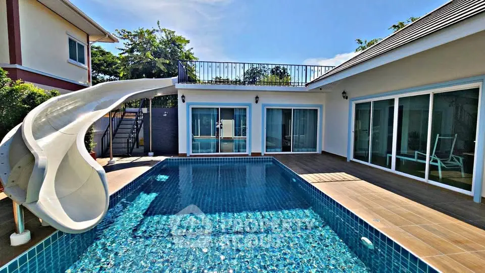 Luxurious villa with private pool and slide, perfect for family entertainment.