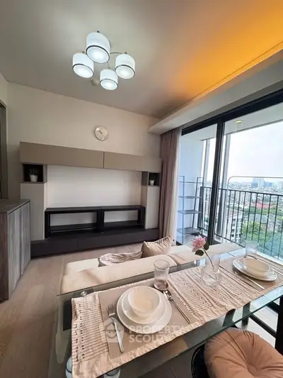 Modern living room with elegant dining setup and balcony view in high-rise apartment.