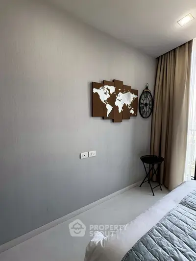 Modern bedroom with world map art and stylish decor