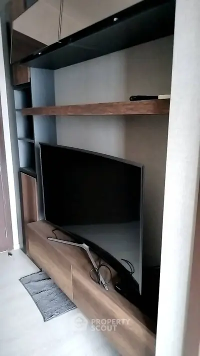 Modern living room with sleek TV unit and stylish shelving