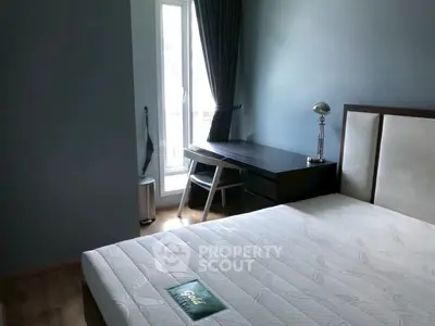 Cozy bedroom with natural light and modern furnishings