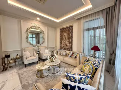 Luxurious living room with elegant decor, plush seating, and stylish accents in a sophisticated setting.