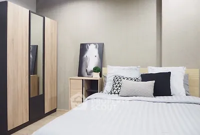 Modern bedroom with stylish decor and cozy bedding