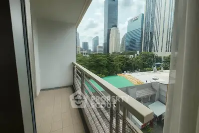 Spacious balcony with city skyline view, perfect for urban living.