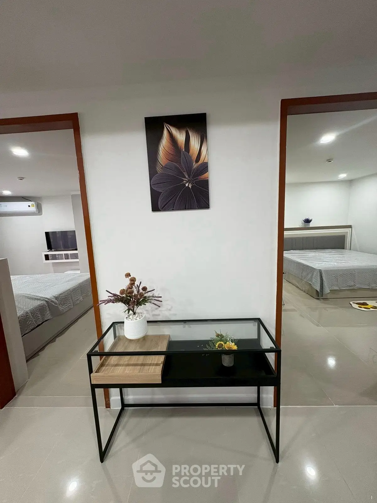 Modern interior hallway with elegant decor and two bedrooms