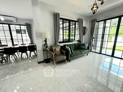 Spacious modern living room with large windows and stylish decor