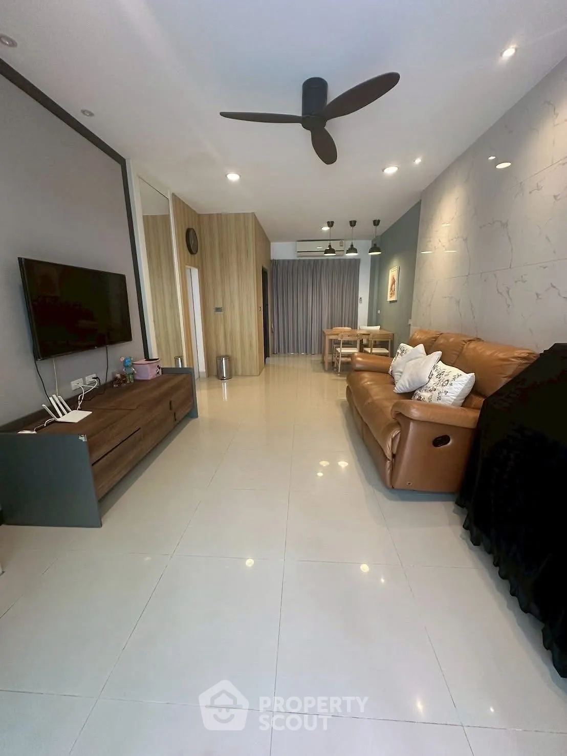 Spacious modern living room with sleek design and comfortable seating