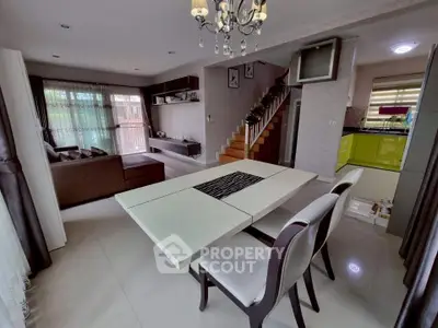 Spacious modern living and dining area with elegant decor and open layout.