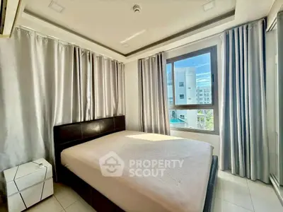 Bright and modern bedroom with large windows and stylish curtains in a contemporary apartment.