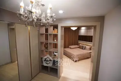Luxurious bedroom with elegant chandelier and modern shelving unit, perfect for stylish living.