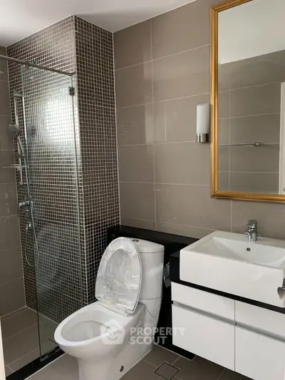 Modern bathroom with glass shower and sleek fixtures