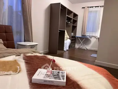 Cozy bedroom with stylish decor and ample storage space