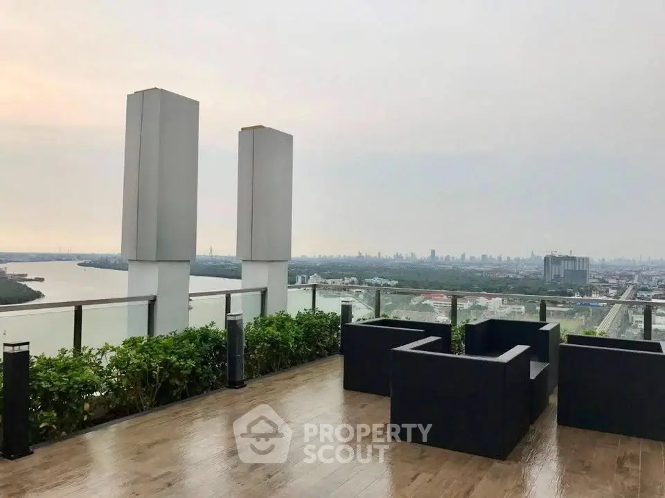 Stunning rooftop terrace with panoramic city and river views, perfect for relaxation and entertainment.