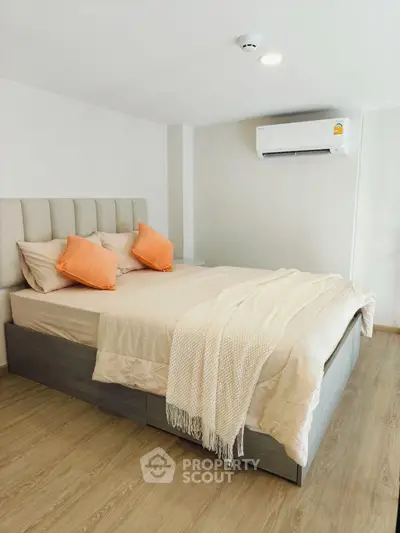 Modern bedroom with stylish decor and air conditioning in a cozy apartment