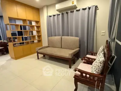 Spacious living room with elegant wooden furniture and modern shelving unit