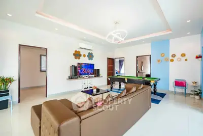 Spacious modern living room with pool table and stylish decor