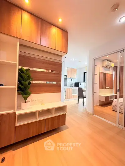 Modern apartment interior with wooden cabinets and sleek design