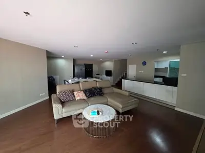 Spacious modern living room with open kitchen and stylish furniture