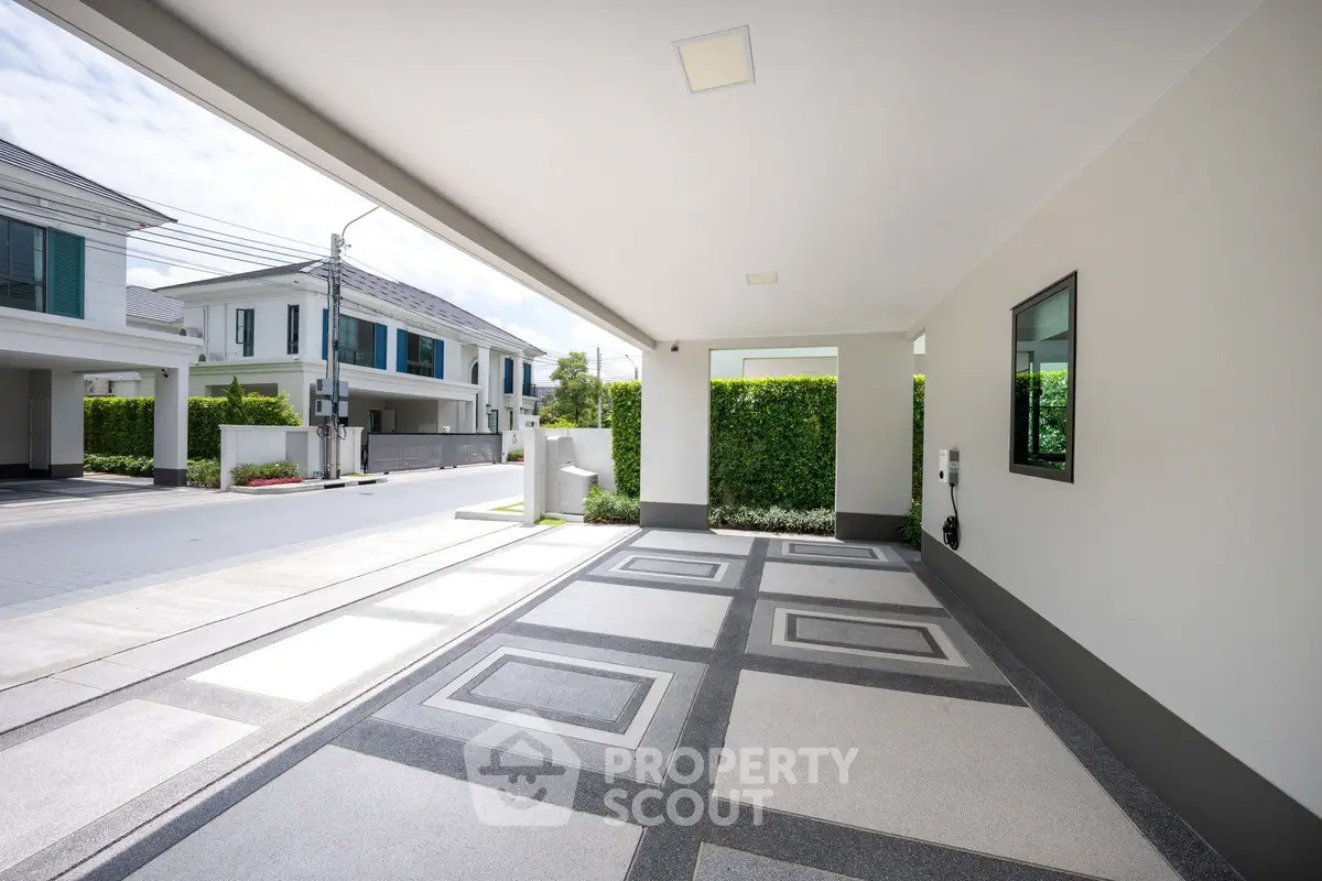Modern residential driveway with sleek design and spacious layout in a suburban neighborhood.