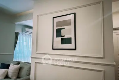 Elegant living room with modern art and cozy seating area