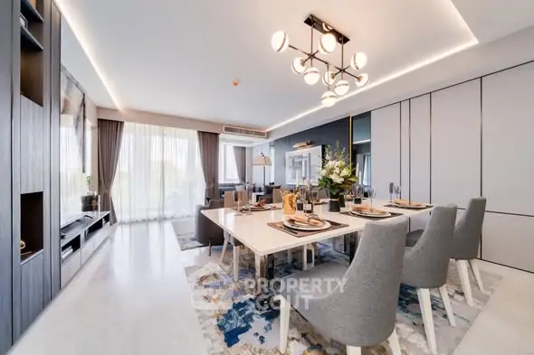 Luxurious dining room with elegant decor and modern lighting in a spacious apartment.
