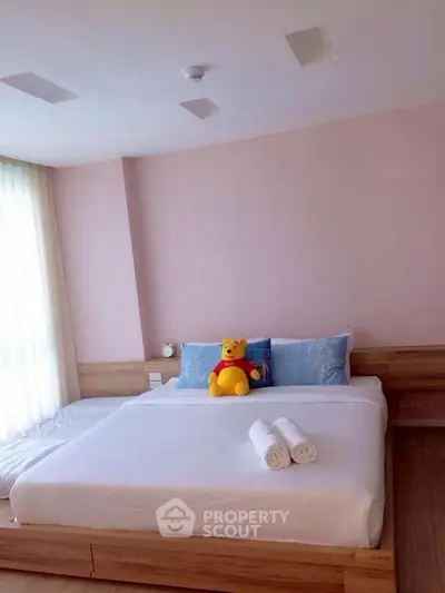 Cozy bedroom with plush bedding and soft lighting, perfect for relaxation.