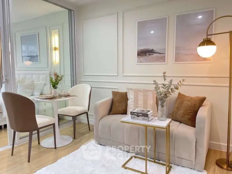 Cozy living room with elegant decor and dining area, featuring modern furniture and soft lighting.