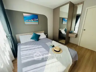 Bright and cozy bedroom with modern decor and ample natural light.